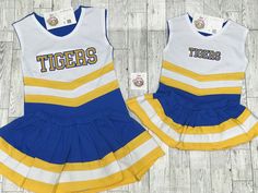 Show your school spirit with these adorable cheer outfits! This is a play cheerleader uniform. Not like a traditional stiff uniform.  The cheer outfit is 95% cotton and 5% spandex.   Available in 17 color combinations. Bloomers are NOT included! The listing for bloomers is separate. **Embroidery on skirts and or the back is NOT currently available** *They run slightly small (especially the length of the skirt), so maybe sizing up would be best for your little one.* Bloomers are NOT included! ** Custom Cheer Uniforms, Cheerleader Outfit, Cheer Uniforms, Pom Pom Girl, Cheer Uniform, Cheer Outfits, Cheer Girl, Cheerleading Outfits, Girls Clothing Sets