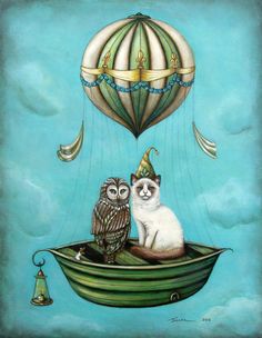 two cats are sitting in a boat with an owl on it