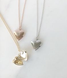 "Heart locket necklace, Locket necklace, gifts for her, birthday gift, dainty locket, heart necklace, rose gold necklace, gold locket, silver locket Delicate and mini heart shaped locket suspended on dainty 18\" cable chain *Heart locket pendant is approx 13mm, inside size is approx 9mm *Available in 3 finishes: Rose Gold Gold Rhodium SHIPPING: *Free domestic shipping on all orders PACKAGING: *All pieces come beautifully packaged, perfect for gift giving. Find more to ❤️ here: http://etsy.com/sh Dainty Open Heart Locket Necklace, Dainty Heart Pendant Locket Necklace With Delicate Chain, Dainty Open Heart Locket Necklace With Heart Charm, Heart Pendant Locket Necklace As Gift For Her, Dainty Heart Pendant Locket Necklace With Charm, Heart Shaped Dainty Locket Necklace With Delicate Chain, Dainty Heart Locket Necklace With Charm, Dainty Heart Locket Necklace With Delicate Chain, Dainty Heart Necklace With Locket