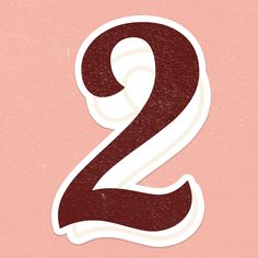 the number two sticker is shown in red and white on a light pink background