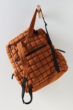 Perfect for hitting the hiking trail and everywhere in between, this functional backpack features a slouchy silhouette and quilted fabrication with a flap-top closure. **Features:** Quilted fabrication, slouchy unstructured silhouette, flap top with a drawstring and snap button closure, adjustable shoulder straps, bungee cord drawstrings at side pockets, lined interior with a zippered pocket, exterior pocket at front, hidden zippered pocket at back **Why We | Quilted Hiker Pack by FP Movement at Functional Backpack, Quilted Backpack, Blue Zones, Printed Wide Leg Pants, Bungee Cord, Christmas Party Dress, Hiking Trail, Argyle Sweater, Black Ballet Flats