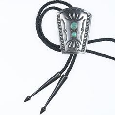 Vintage Navajo hand stamped silver bolo tie with turquoise.  Very nice workmanship, apparently unmarked.  38" long, other measurements in pics. 

 Marked or unmarked as shown in pics, weight and other measurements in pics. Sorry but my jewelry is stored in a secure location and cannot be accessed for more pictures,
videos, or measurements until sold. If you look at pictures/description your
question should be answered. Thank you so much for your time and consideration!

All precious metals are t Adjustable Southwestern Silver Turquoise Necklace, Southwestern Lariat Bolo Tie For Rodeo, Artisan Silver Lariat Bolo Tie, Handmade Southwestern Silver Bolo Ties, Artisan Turquoise Bolo Ties With Concho, Southwestern Turquoise Lariat Bolo Tie, Concho Lariat Bolo Ties For Rodeo, Southwestern Silver Bolo Ties For Rodeo, Southwestern Silver Bolo Tie For Rodeo