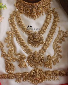 an elaborate gold necklace and earrings set on display