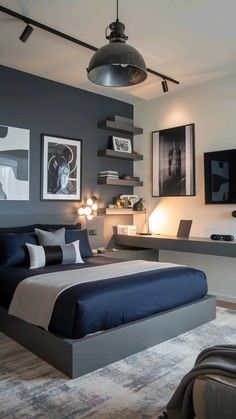 a bedroom with gray walls and blue bedding