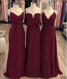 two bridesmaid dresses are on display in the store, and one is red