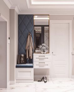 a white and blue entryway with shoes on the floor, coat rack and mirror