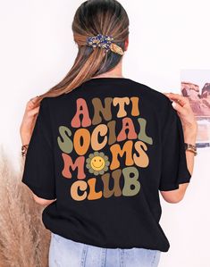 Anti Social Moms Club Unisex T Shirt 100% Cotton Quick Turnaround Time Ships within 1-4 Business Days Relaxed fit Topstitched, classic width, rib collar Shoulder to shoulder twill tape Care Instructions: Wash item inside out in cold water, do not bleach, do not dry clean, do not iron directly on the design. Tumble dry low. Retro Black Tops With Funny Text, Retro Black Top With Funny Text, Anti Social Moms Club, Club T Shirt, Moms Club, New Mom Gift, Club Shirts, Retro Shirts, Anti Social