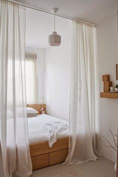 a bedroom with white curtains and a bed in the corner that says comfy bedroom