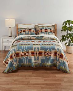 Crafted with USA-made wool in our Pendleton, Oregon mill, the Pendleton Unnapped Shale Harding Blanket-King is one of our most iconic designs. It was first presented to President Warren Harding's wife Florence during a 1923 dedication ceremony for part of the Oregon Trail. Instantly popular, this blanket is based on the famous Chief Joseph design, and continues to be loved by customers around the world. King Size 108” x 90” Queen and king sizes are unnapped and have Ultrasuede® trim Pure virgin Pendleton Bedroom, Log Cabin Bedroom, Pendleton Bedding, Western Bedding Sets, Dedication Ceremony, Pendleton Oregon, Bedroom Comforter Sets, Chief Joseph, Western Bedroom Decor