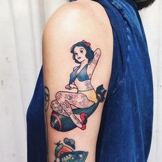 a woman with a tattoo on her arm