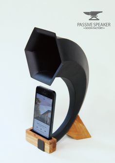 a cell phone sitting on top of a wooden stand