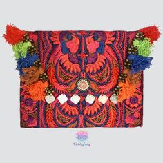 This Colorful Clutch is the ultimate boho-chic accessory. This gorgeous bohemian clutch bag is the perfect accessory to give a unique look to your casual outfits or night out events. Can be also used as an amazing iPad case. Handcrafted by talented artisans using a stunning fabric embroidered by the Hmong hill tribes in Northern Thailand. Details: Material: Embroidered cotton fabric with discreet birds design. Tassel and coins decoration. Magnetic closure with interior zipper pocket Cotton linni Pom Pom Clutch, Handbags For Girls, Colorful Clutch, Bohemian Clutch, Embroidered Clutch Bag, Boho Chic Accessories, Teaching Sewing, Birds Design, Embroidered Clutch