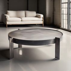 a white couch sitting next to a coffee table