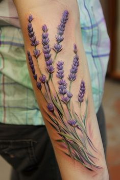 a woman's arm with lavender flowers on it