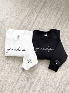 three sweatshirts that say grandma and grandpa are laying on the floor next to each other