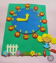 a child's clock made out of paper with numbers and flowers on the side