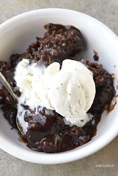 a bowl filled with ice cream and chocolate pudding