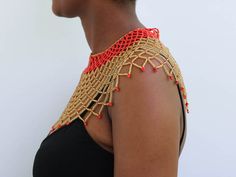 AMAZI Beaded cape necklace made using 100% fine beads.

Color: Red and Gold

Closure: hook

Length: 16 inches long

Material: Beads

It is made on order hence it's ready to ship within 1-3 days.

Shipping cost is calculated during checkout.

DHL Express shipping that takes  3-5 days to be delivered Beaded Cape, Necklace Patterns, Maasai, Christmas Gifts For Mom, Red And Gold, Perfect Christmas Gifts, Dhl Express, Beautiful Necklaces, Cape