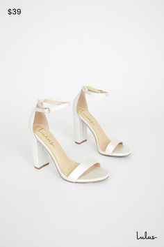 No one does it quite like the Lulus Taylor Ivory Satin Ankle Strap Heels! Whether you choose to dress them up or down, these sleek, satin single sole heels will stun with their slender toe strap, and adjustable ankle strap (with a gold buckle). 4" wrapped block heel. Cushioned insole. Nonskid rubber sole. Upper Material: Fabric. Sole Material: TPR. Imported. Lulus | Taylor Ivory Satin Ankle Strap Heels. Low Heel Satin Heels, Satin Heels With Low Heel, Fitted Satin Heels With Low Heel, Fitted Satin Low Heel Shoes, White Satin Ankle Strap Heels, Satin Heels With Padded Heel And Round Toe, Fitted Block Heel Prom Heels, White Sleek Open Heel Heels, Fitted Satin Open Toe Heels