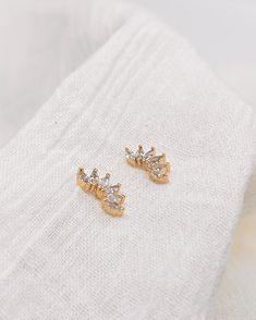 Marquise crystals fanned out for the perfect ear climber / stud duo. Wear these sparkly studs with any outfit to dress it up. Model is shown pairing it with our classic huggies! Details: 11MM X 5MM. Gold filled, nickel free, tarnish free, hypoallergenic, waterproof. Processing time is 2-5 days in our Santa Rosa Studio. Each order is shipped via USPS. Marquise Cut Earrings With Diamond Eyes, Gold Marquise Earrings For Party, Marquise Cut Diamond Eyes Earrings Gift, Marquise Cut Diamond Accent Earrings For Gifts, Marquise Cut Diamond Accent Earrings As Gift, Gift Earrings With Diamond Accents And Marquise Cut, Gift Marquise Diamond Earrings For Pierced Ears, Marquise Gold Earrings With Diamond Eyes, Dainty Gold Marquise Earrings