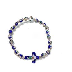 "Blessed small beads - Blue Cloisonne ' Bracelet - Blessed by Pope Francis This is a special item, blessed by Papa Francesco (Pope Francis) during public blessing in St. Peter square. It can be blessed again after the sale if requested. Just ask me! Comes with a parchment paper COA blessing. This is a stretch on bracelet. Diameter at which naturally rests: 2.5\" This version has the smaller beads. Adjusts to any woman wrist size. It's really fine and classy. This model is really beautiful and a Adjustable Hand-strung Blue Pearl Bracelet, Adjustable Blue Rosary Bracelet With Cross, Spiritual Beaded Cross Bracelets, Adjustable Silver Rosary Bracelet With Colorful Beads, Adjustable Spiritual Rosary Bracelet With Silver Beads, Adjustable Blue Hand-strung Rosary Bracelet, Adjustable Silver Beads Spiritual Rosary Bracelet, Adjustable Hand-strung Blue Rosary Bracelet, Blue Cross Bracelets For Gifts