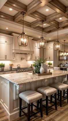 a large kitchen with an island in the middle and four stools at the end