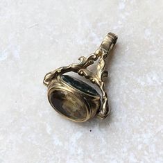 Victorian 9 carat gold three stone pendant fob. How beautiful is this piece! You catch a different stone framed by beautiful gold detailing depending on which side the pendant decides to reveal.CONDITION: Wear consistent with age and use. Please see photos for more detail.APPROX. STONE FACE SIZE: 7mm x 9mmAPPROX. FOB SIZE (INC. DROP): 23mmWEIGHT: 3.4 gramsTHANK YOU FOR LOOKING :) Memento Mori Ring, White Sapphire Ring, Gold Signet Ring, Hand Ring, Enamel Ring, Amethyst Pendant, Ring Photos, White Sapphire, Stone Pendant