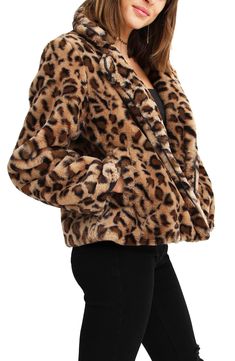 A soft faux fur jacket is detailed with a leopard print for trendy looks. 23'' length (size S) Notch collar Long sleeves Front button closure 100% polyester faux fur 
 Hand wash Imported Model stats: 5'10" height, 32" bust, 25" waist, 36" hip. Model is wearing size S. Fall Leopard Print Fur Coat With Faux Fur Lining, Fall Leopard Print Faux Fur Coat, Winter Leopard Print Faux Fur Outerwear, Leopard Print Outerwear With Faux Fur Trim, Fitted Faux Fur Outerwear In Leopard Print, Fitted Leopard Print Faux Fur Outerwear, Fall Leopard Print Outerwear With Faux Fur Trim, Winter Leopard Print Outerwear With Faux Fur Trim, Leopard Print Faux Fur Coat With Lining