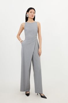 Tailored Wool Blend Wide Leg Wrap Detail Jumpsuit - Grey - Structured proportions elevate this jumpsuit, tailored with soft wool in a contemporary wrap design, while a wide leg style caters for a relaxed touch. Finished with a round neck and sleeveless arms, pair this piece with slingback heels for start workwear. Wrap designJumpsuit styleWide leg Ninang Outfit, Grey Jumpsuit Outfit, Professional Jumpsuit, Business Casual Jumpsuit, Business Jumpsuit, Classic Jumpsuit, Structured Fashion, Relaxed Tailoring, Work Jumpsuit