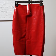 Step Into Elegance With The Westward Bound Pencil Latex Rubber Skirt In Striking Supatex Red, Tailored To Xs/S (Uk 08, Usa 06). This Captivating Skirt Redefines Sophistication With A Bold Allure. Meticulously Crafted, The Vibrant Supatex Red Hue Exudes Confidence, Elevating Any Ensemble With Its Fiery Charm. The Xs/S Size Ensures A Tailored Fit, Embracing Your Curves Flawlessly. Made From High-Quality Latex Rubber, This Skirt Promises Both Luxurious Comfort And Striking Appeal. Effortlessly Elevate Your Style With This Piece, A Fusion Of Chic Elegance And Bold Design, Perfect For Making A Confident Statement In Any Setting. In Like New Condition, Only Worn Once For A Photoshoot. All Item Red Stretch Pencil Skirt For Party, Red Stretch Knee-length Pencil Skirt, Red Fitted Skirt For Workwear, Red Fitted Pencil Skirt, Red High Waist Fitted Pencil Skirt, Red Fitted High Waist Pencil Skirt, High-waisted Red Fitted Pencil Skirt, Red High Waist Fitted Mini Skirt, Red Fitted High Waist Mini Skirt