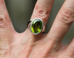 Peridot Ring Size 6.5 - Peridot ring - Peridot Ring - August Birthstone - August Birthstone - Peridot jewelry- Size 6.5 Ring Large clean peridot ring. Excellent quality. the stone measures 15mm x 11mm. The size is USA 6.5 Peridot is known as a stone of abundance and can be used to help strengthen one's work - whatever that work may be - raising children, working as a healer, tending one's garden, performing in an office position, teaching or helping others... Peridot works on the 3rd and fourth Peridot Ring Jewelry, Round Peridot Stone Jewelry, Round Peridot Jewelry With Stones, Lime Green Gemstone Ring Jewelry, Lime Green Gemstone Ring, Lime Green Peridot Ring, Oval Green Rings With Stones, Green Oval Rings With Stones, Oval Peridot Gemstone Ring