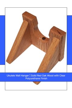 a wooden object with the words ukulele wall hanger solid oak wood with clear polyuretta finish