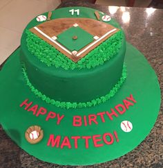 a baseball themed birthday cake with green frosting