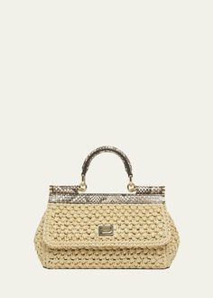 "Find DOLCE & GABBANA Sicily Small Python & Raffia Top-handle Bag on Editorialist. Dolce & Gabbana \"Sicily\" top handle bag in rayon/cellulose acetate, raffia, and python leather Top handle Detachable, adjustable crossbody strap Can be worn as a top handle or crossbody bag Flap top with magnetic closure; logo hardware Interior, one slip pocket Lining: Cotton Feet protect bottom of bag Approx. 5.1\"H x 7.8\"W x 2.3\"D Made in Italy" Designer Beige Shoulder Bag With Bamboo Handle, Designer Beige Bag With Bamboo Handle, Luxury Natural Straw Bag With Gold-tone Hardware, Designer Crochet Woven Bag, Designer Natural Straw Bag With Gold-tone Hardware, Designer Straw Top Handle Bag, Designer Straw Bag With Gold-tone Hardware, Luxury Beige Straw Bag With Gold-tone Hardware, Luxury Woven Straw Bag With Top Handle