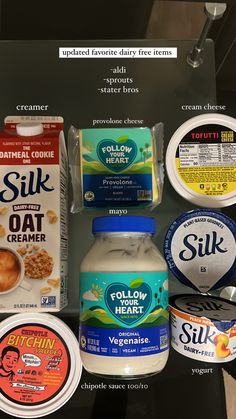 an assortment of yogurt products displayed on a shelf