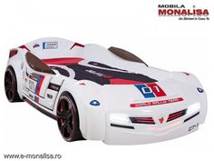 a white toy car with red and blue stripes