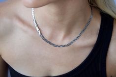 A must have! Three delicate herringbone threads form a beautiful braided necklace. Product Details Water friendly, gold or silver plated stainless steel Length: 16" plus 2" extender Width: 1/4" braid Trendy Braided Jewelry, Adjustable Herringbone Snake Chain Necklace, Silver Herringbone Necklace With Delicate Chain For Everyday, Handmade Chain Necklace For Everyday, Everyday Silver Herringbone Necklace With Delicate Chain, Handmade Everyday Chain Necklace, Sterling Silver Herringbone Necklace For Everyday, Silver Metal Herringbone Necklace, Handmade Jewelry With A Modern Look