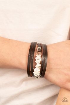 A brown leather band is spliced into rugged layers around the wrist. Infused with textured silver rings, the centermost strand is infused with a stack of white shell-like accents for a tropical inspired finish. Features an adjustable snap closure. Sold as one individual bracelet. White Bracelets, Spoon Jewelry, T Shirt And Jeans, Paparazzi Accessories, Affordable Jewelry, Silver Accents, Paparazzi Jewelry, Jewelry Cleaner, White Beads