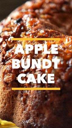 an apple bundt cake on a yellow plate with the words, apple bundt cake