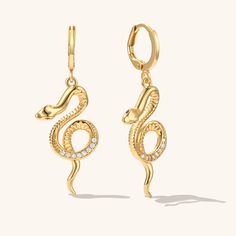 These Serpent Earrings are the perfect addition to your jewelry collection. The design features a slithering snake that wraps around your ear lobe, adding a touch of edgy style to your look. Crafted with attention to detail, the earrings are made of high-quality materials and have a comfortable fit. Sold as a pair. Serpent Earrings, Slithering Snake, Serpent Jewelry, Snake Jewelry, Snake Earrings, Edgy Style, Creative Arts, Animal Jewelry, Edgy Fashion