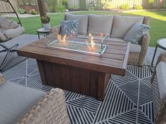 a fire pit sitting on top of a wooden table