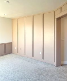 an empty room with several closets and carpeted flooring is shown in the foreground