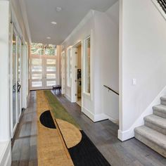 the hallway is clean and ready for us to use as an entrance way in this house