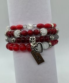 "Red roses for a beautiful lady are sure to win her heart. The shades of red with white accents of this 4 bracelet set are a bright and stunning color combination. Her wrist will be wrapped in ruby, quartzite, cat eye, bamboo coral with crystal and silvery accents. The \"Love\" and heart charms complete the love theme. Your bracelets will arrive in a jewelry box, perfect for gifting or keeping. **Please note** I have used strong 1 mm elastic and I use a triple tie on my bracelets to be sure they Luxury Red Handmade Beaded Bracelets, Tourmaline Earrings, Pumpkin Earrings, Girl Jewelry, Beaded Drop Earrings, Fall Earrings, Elastic Bracelet, Glass Beaded Bracelets, Wire Wrapped Earrings