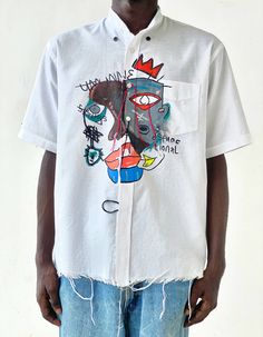 Locally made by artisans, the umunne shirt is emblazoned in a motif of my younger siblings rendered in the neo-expressionist art style. The vibrant colors capture the romance of summer and evoke a sweet sense of nostalgia. Cut from lightweight Linen to have a loose fit and boxy silhouette, The band collared shirt has a Spring Shirt With Unique Print And Relaxed Fit, Summer Cotton Graffiti Print Top, Summer Cotton Top With Graffiti Print, Artistic Cotton Tops For Summer, Summer Shirt With Unique Print And Relaxed Fit, White Shirt With Abstract Print For Spring, Summer Shirt With Unique Print, Relaxed Fit, Artistic Cotton Tops With Graffiti Print, White Artistic Shirt For Summer