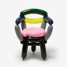 an inflatable chair that is shaped like a child's toy with different colors and shapes