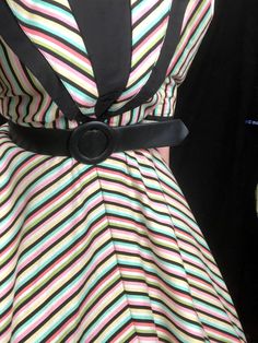 "Vintage 1940's Style Rainbow Black White Striped Avant Garde Fit and Flare Dress by \"Foxy Lady - San Francisco!\" Features: - an eye-catching black, white, and pastel rainbow striped print - edgy, dramatic pointed collar, with black cotton underside - pleating at tops of sleeves to create dramatic puff shoulders and sleeves - sleeves are a 3/4 length with upturned, split, winged cuffs with a decorative black button - bodice can be worn tight, or bloused, depending on your measurement - nipped 1950s Style Black Dress For Retro-themed Events, Black 1950s Style Dress For Retro Events, Lined Retro Vintage Dress, Black Retro Style Dress For Retro-themed Events, Lined Vintage Dress In Retro Style, Lined Retro Vintage Dress For Vintage Fashion, Black Retro Dress For Vintage Events, Black Vintage Dress For Costume Party, Lined Retro Vintage Dress For Vintage Events