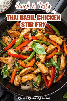 thai stir fry with chicken and vegetables in a skillet on top of a table