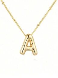 a gold necklace with the letter a on it