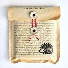 an old book with some buttons attached to it